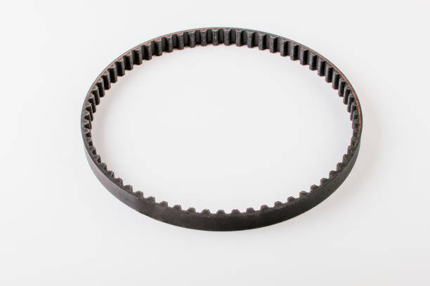 Spare parts Timing belt, pulley and tensioner for car. Isolate auto parts on white.