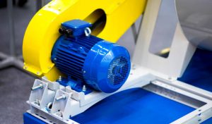Industrial machinery of blue hydraulic pump, blur background Industrial machinery of blue hydraulic pump, blur background