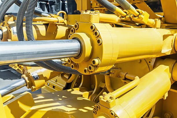 hydraulics tractor yellow. focus on the hydraulic pipes hydraulics tractor yellow. focus on the hydraulic pipes